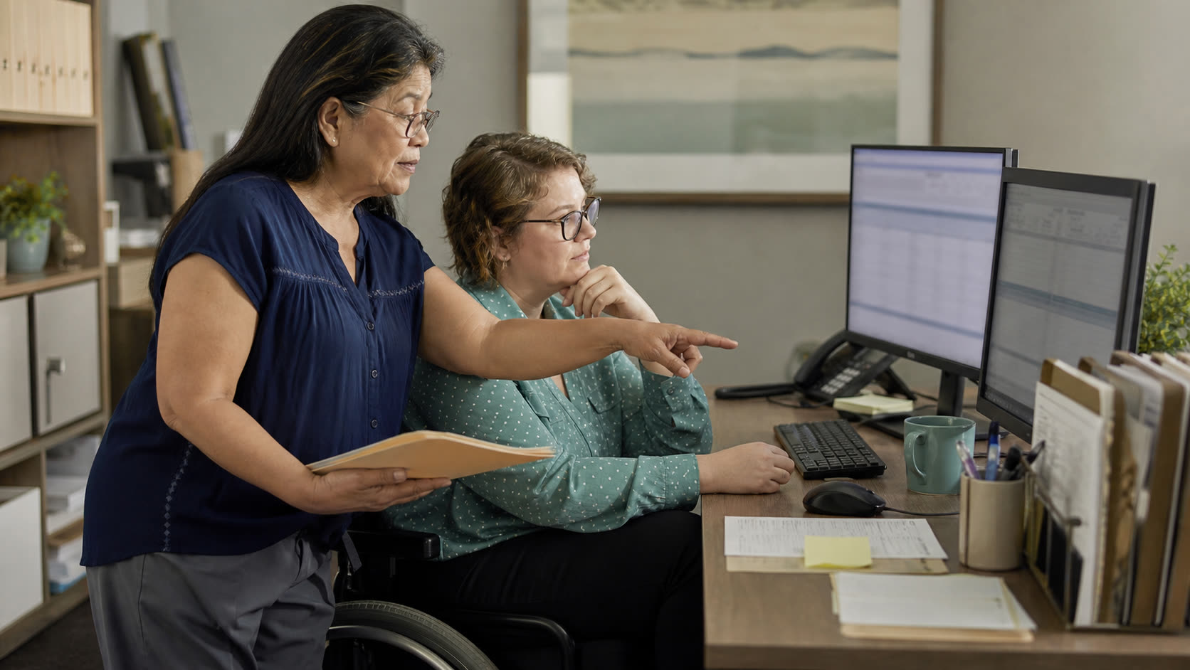 A medical billing professional reviewing work with an AI-assisted screen while maintaining human control