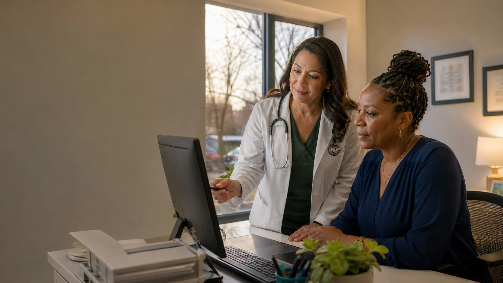 A diverse healthcare revenue team reviewing work together in a calm office